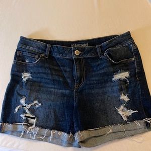 Maurice’s jean shorts distressing on front and back.